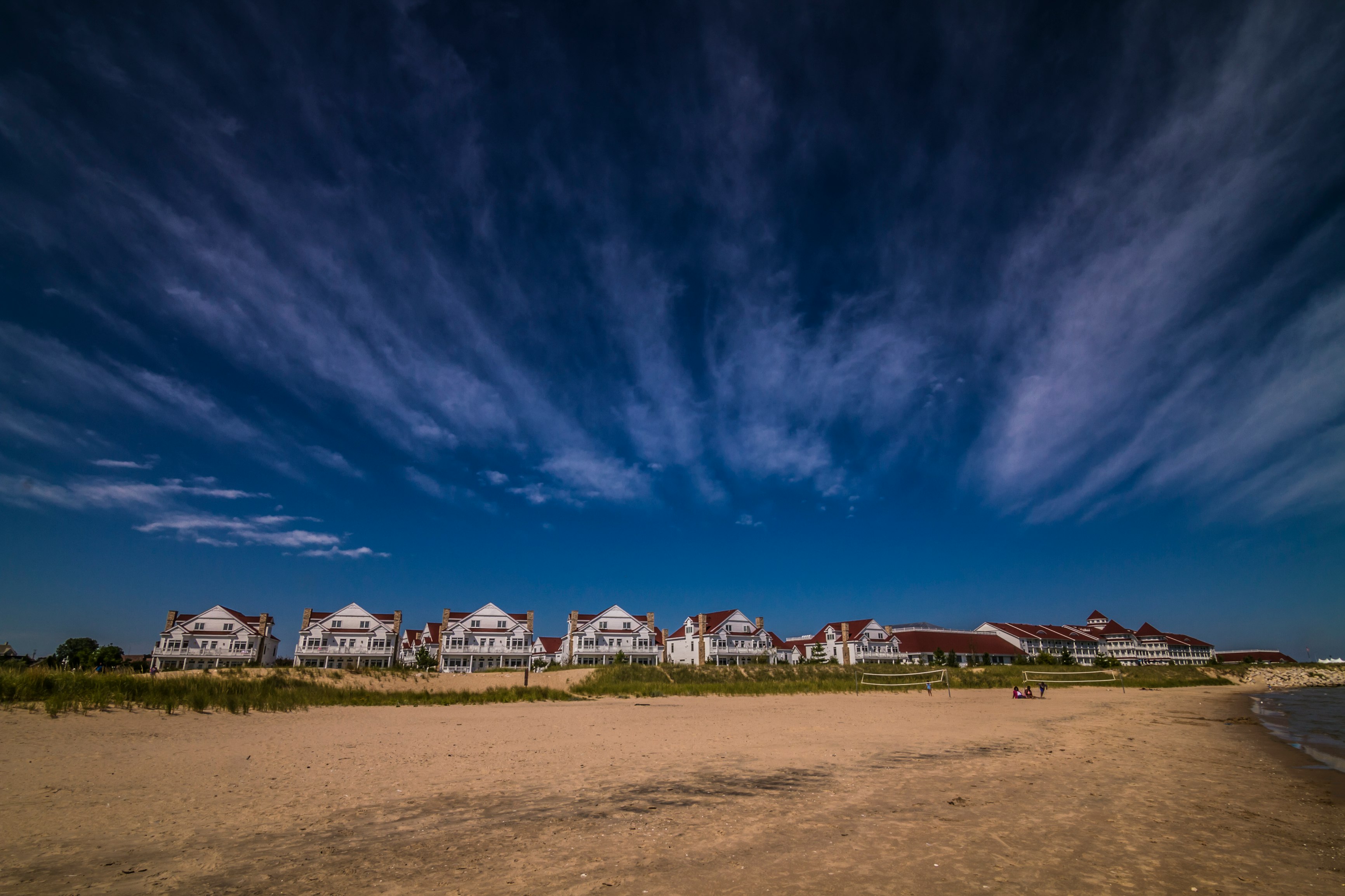 landscape photography of house under white clouds